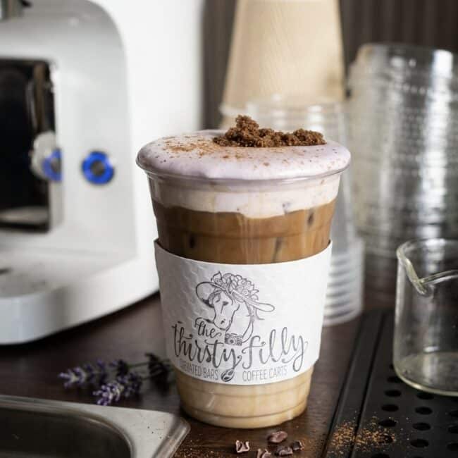 Iced latte in a branded The Thirsty Filly cup from the mobile espresso bar